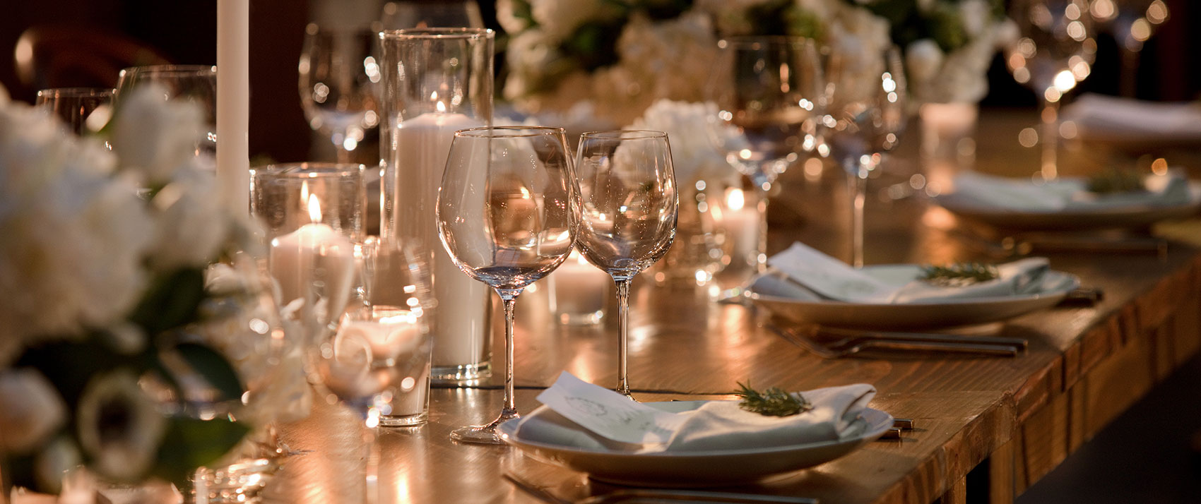 wedding reception table set with flowers and candles